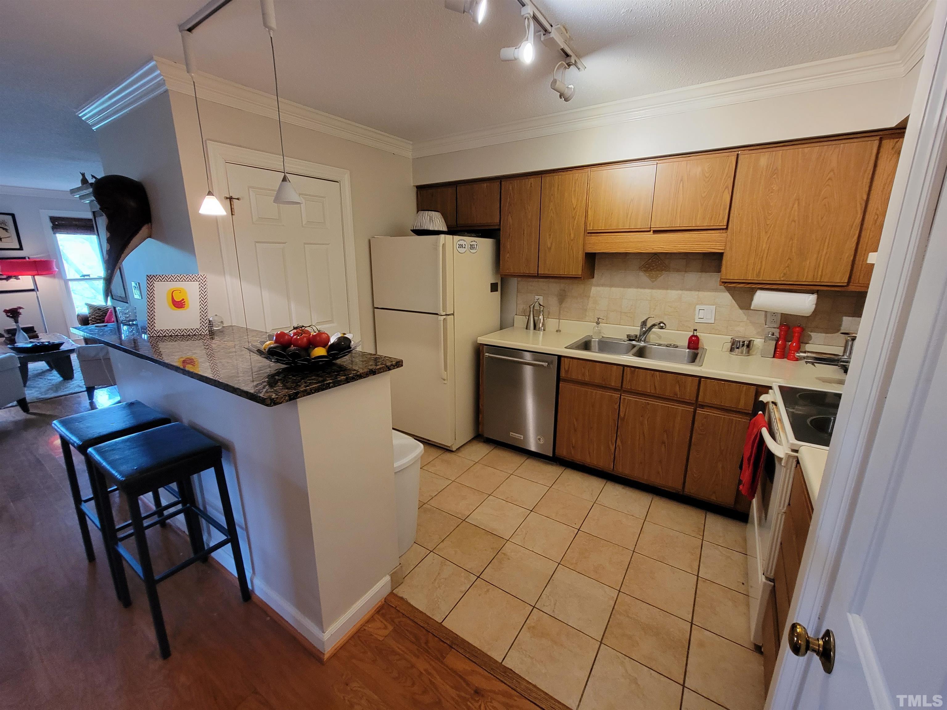 3601 Helix Court, Unit 302 Raleigh, NC 27606 - Photo 9 of 21 a utility room with sink dryer and washer