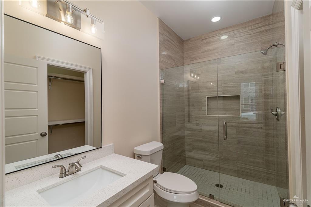 5406 North Crown Point Pharr, TX 78577 - Photo 11 of 15 a bathroom with a sink a toilet and shower
