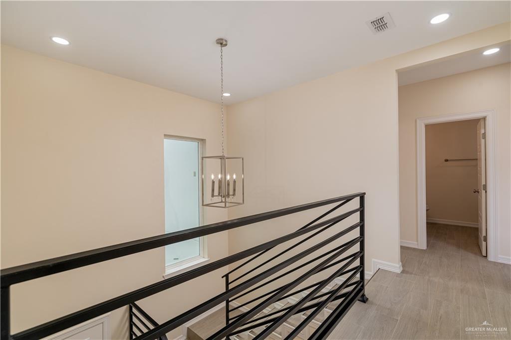 5406 North Crown Point Pharr, TX 78577 - Photo 13 of 15 a view of a hallway with a white walls