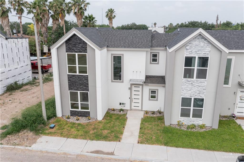 5406 North Crown Point Pharr, TX 78577 - Photo 2 of 15 a view of a yard in front of a house with plants