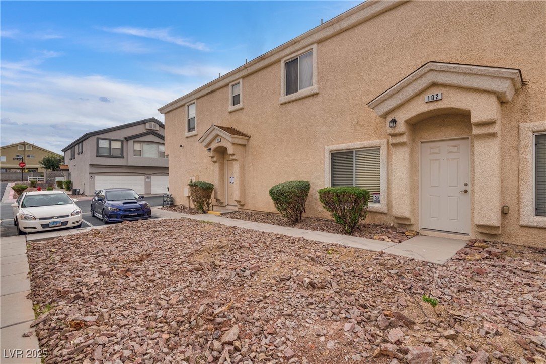 6354 Rusticated Stone Avenue, Unit 101 Henderson, NV 89011 - Photo 20 of 21 View of front of house featuring stucco siding
