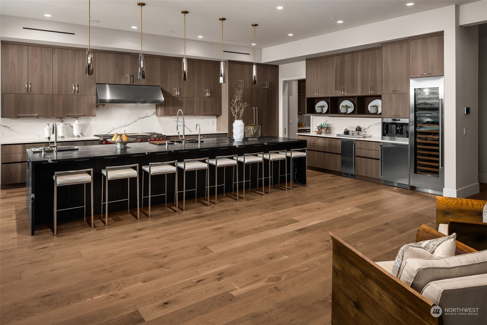 3263 Evergreen Point Road Medina, WA 98039 - Photo 10 of 37 a kitchen with stainless steel appliances wooden cabinets dining table and chairs