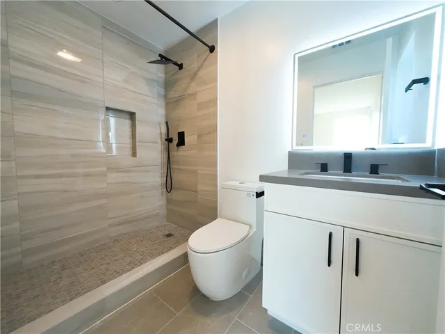 a bathroom with a toilet and a sink