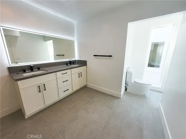 a view of cabinets with granite countertop