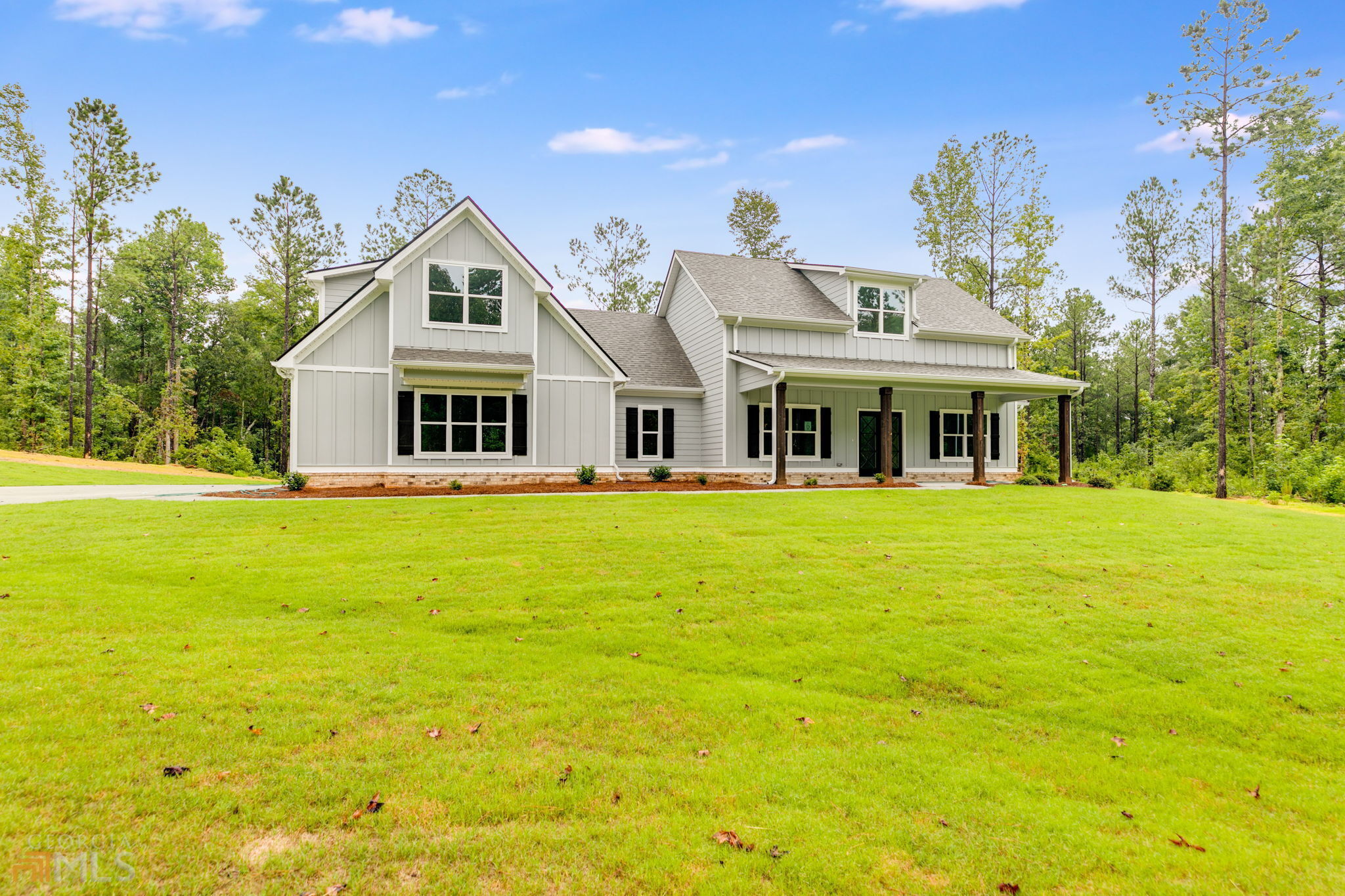 555 Mooyn Road Carrollton, GA 30116 - Photo 1 of 1 a front view of a house with swimming pool