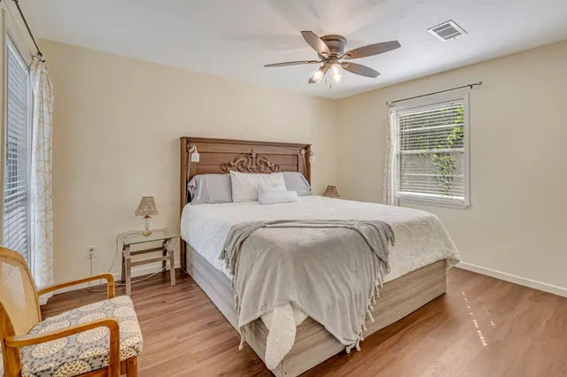 a bedroom with a bed and window