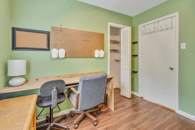 a workspace with furniture and wooden floor