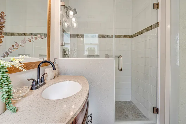 a bathroom with a sink and mirror