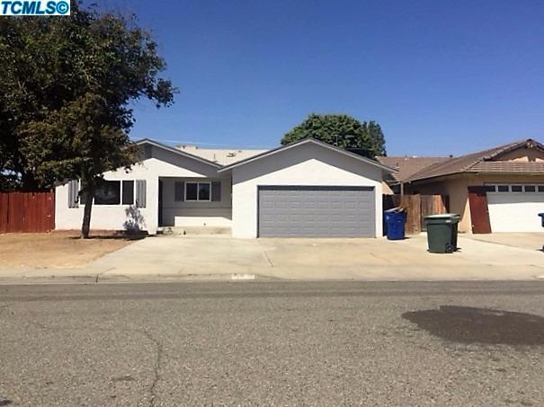 122 West Spring Lane Lemoore, CA 93245 - Photo 1 of 17 a front view of a house with a yard