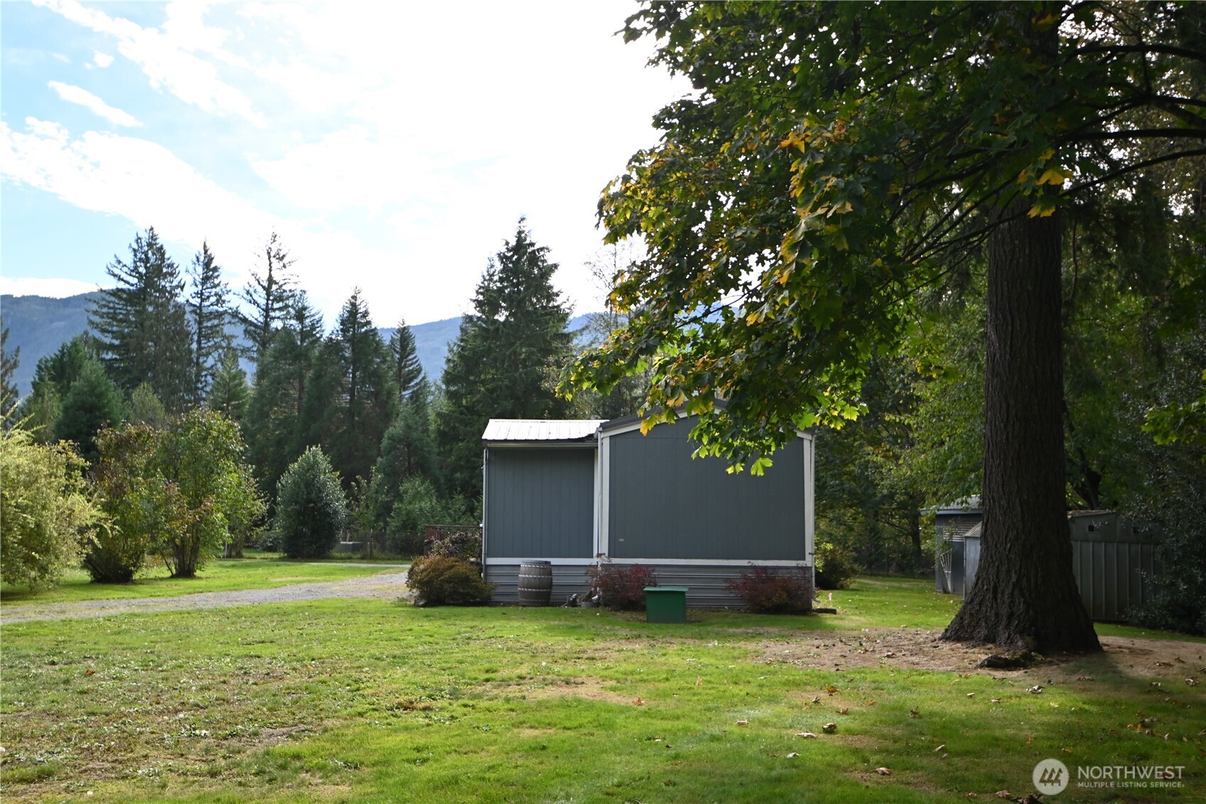 604 Blueberry Lane Gold Bar, WA 98251 - Photo 15 of 24 a view of a backyard with a garden