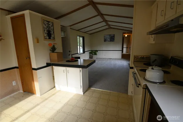 a bathroom with a sink a mirror and shower