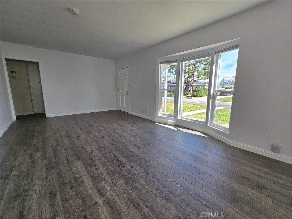 2303 Graydon Avenue Monrovia, CA 91016 - Photo 2 of 16 a view of an empty room with wooden floor and a window