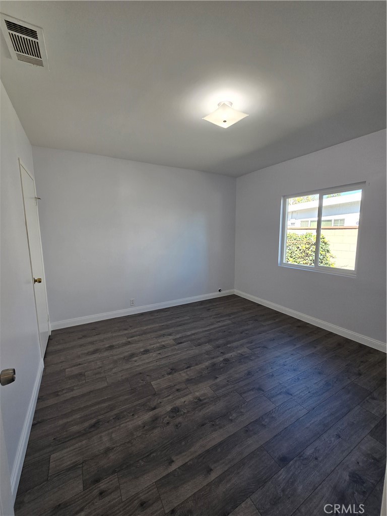 2303 Graydon Avenue Monrovia, CA 91016 - Photo 5 of 16 an empty room with wooden floor and windows