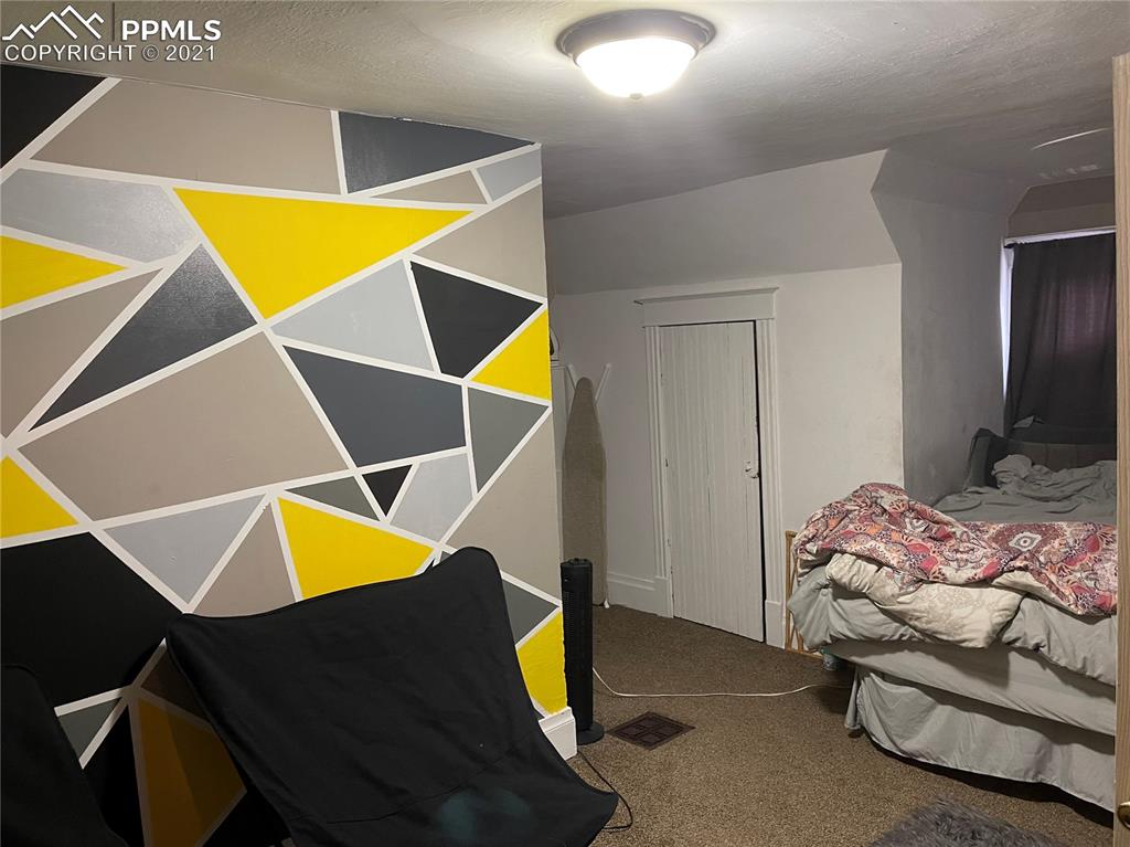 2210 East Routt Avenue Pueblo, CO 81004 - Photo 11 of 23 a bed room with a bed and small