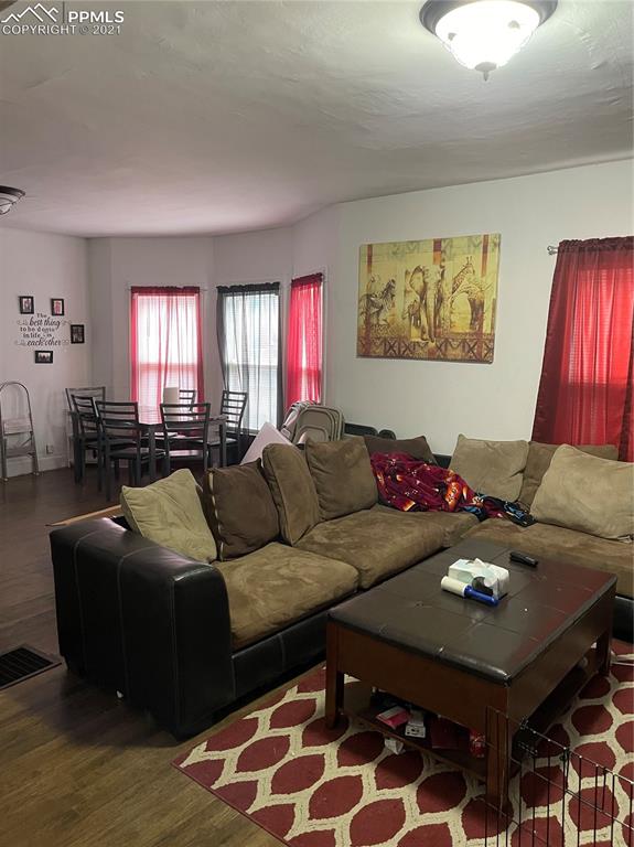 2210 East Routt Avenue Pueblo, CO 81004 - Photo 13 of 23 a living room with furniture and a rug