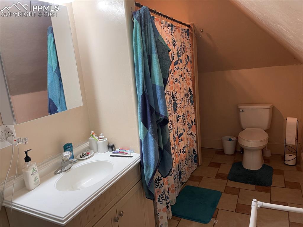 2210 East Routt Avenue Pueblo, CO 81004 - Photo 16 of 23 a bathroom with a sink toilet and shower