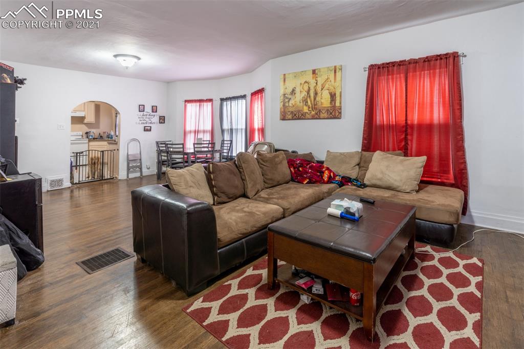 2210 East Routt Avenue Pueblo, CO 81004 - Photo 3 of 23 a living room with furniture and a flat screen tv