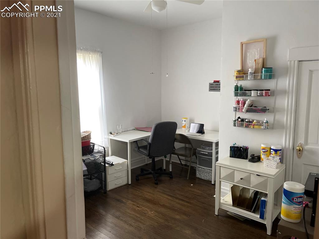 2210 East Routt Avenue Pueblo, CO 81004 - Photo 21 of 23 a workspace with furniture and wooden floor