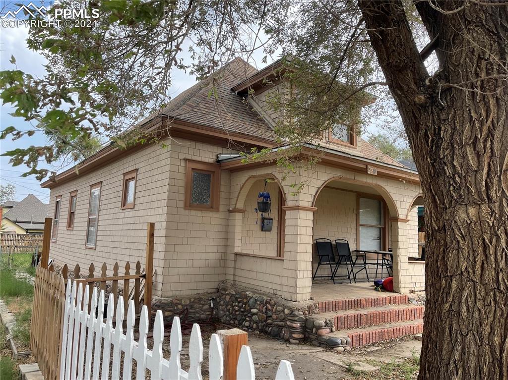 2210 East Routt Avenue Pueblo, CO 81004 - Photo 22 of 23 a front view of a house with garden