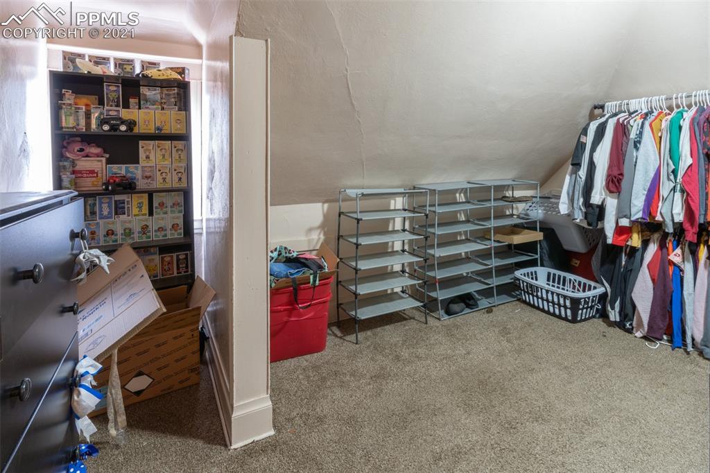 2210 East Routt Avenue Pueblo, CO 81004 - Photo 5 of 23 a view of walk in closet with clothes and shoes
