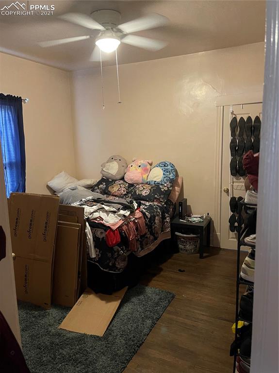 2210 East Routt Avenue Pueblo, CO 81004 - Photo 7 of 23 a bed sitting in a bedroom next to a window