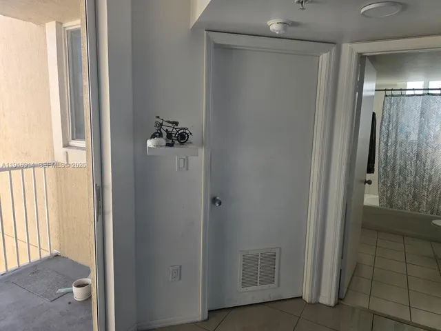 a view of hallway with shower