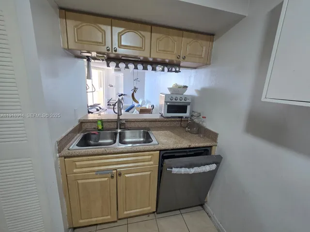 a kitchen with a stove and cabinets
