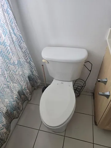 a close view of a toilet in a bathroom