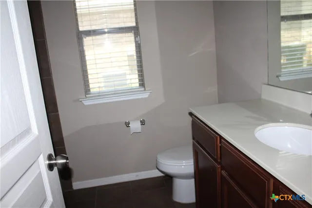 a bathroom with a sink a toilet and tub