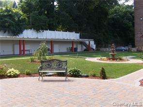678 Warburton Avenue, Unit 6L Yonkers, NY 10701 - Photo 12 of 14 a view of backyard with outdoor seating and green space