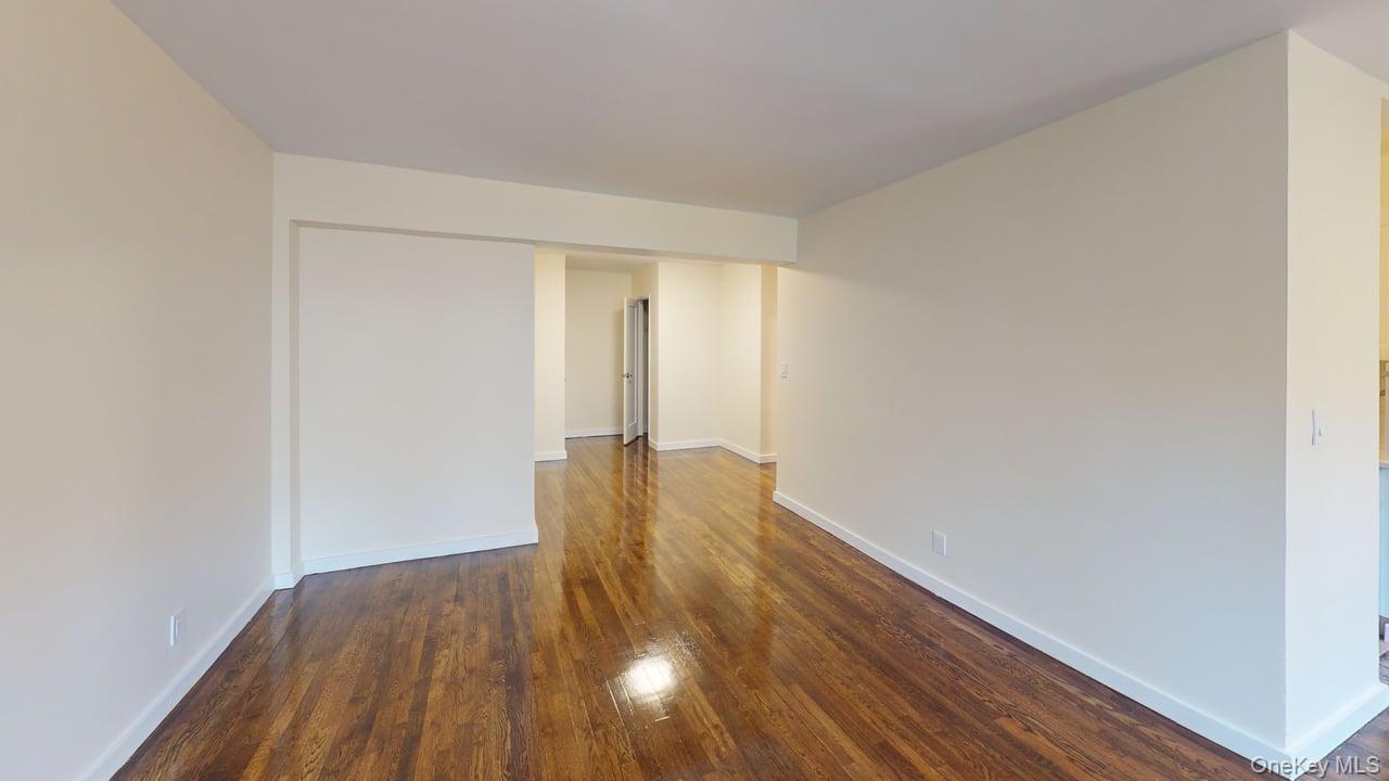 678 Warburton Avenue, Unit 6L Yonkers, NY 10701 - Photo 7 of 14 a view of empty room with wooden floor