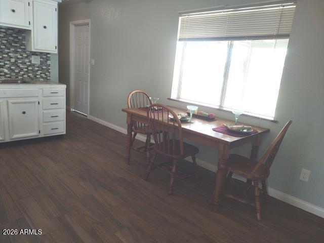 308 South 3rd Street Buckeye, AZ 85326 - Photo 9 of 37 a dining room with furniture and window