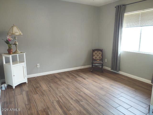 308 South 3rd Street Buckeye, AZ 85326 - Photo 11 of 37 a view of room with window and wooden floor