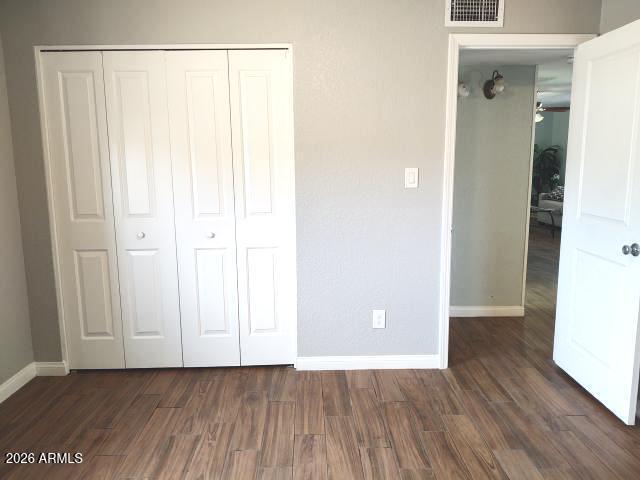 308 South 3rd Street Buckeye, AZ 85326 - Photo 12 of 37 an empty room with wooden floor and closet