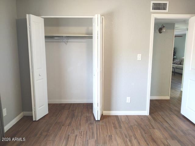 308 South 3rd Street Buckeye, AZ 85326 - Photo 13 of 37 an empty room with wooden floor & closet