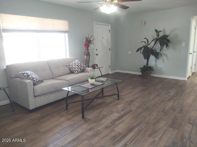 308 South 3rd Street Buckeye, AZ 85326 - Photo 5 of 37 a living room with furniture and a window