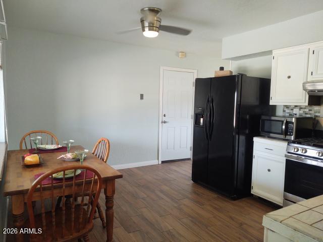 308 South 3rd Street Buckeye, AZ 85326 - Photo 8 of 37 a kitchen with stainless steel appliances granite countertop a refrigerator a stove a sink and dishwasher
