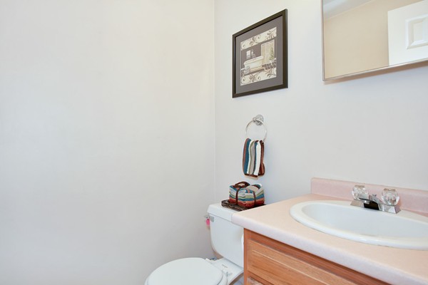 11 Robbins Road Ayer, MA 01432 - Photo 12 of 30 a bathroom with a toilet a sink and mirror