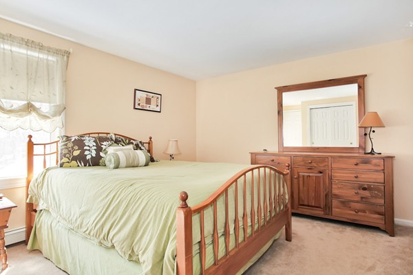 11 Robbins Road Ayer, MA 01432 - Photo 13 of 30 a bedroom with a bed and a dresser