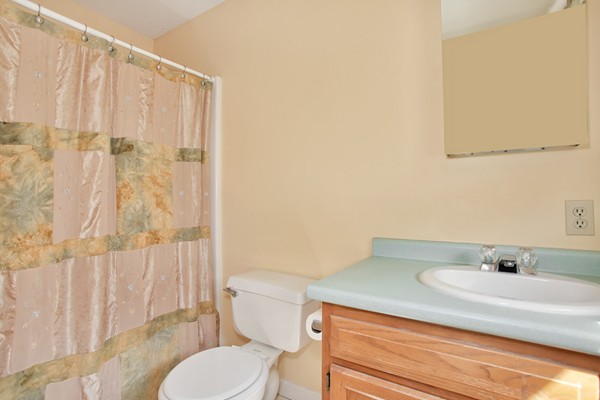 11 Robbins Road Ayer, MA 01432 - Photo 15 of 30 a bathroom with a sink and toilet