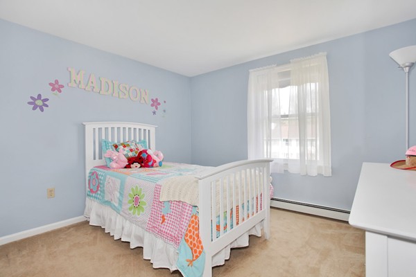 11 Robbins Road Ayer, MA 01432 - Photo 16 of 30 a bedroom with furniture and a bed