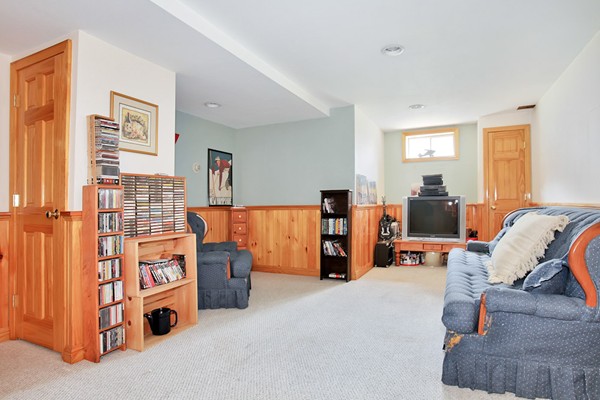 11 Robbins Road Ayer, MA 01432 - Photo 21 of 30 a bed room with furniture and a lamp