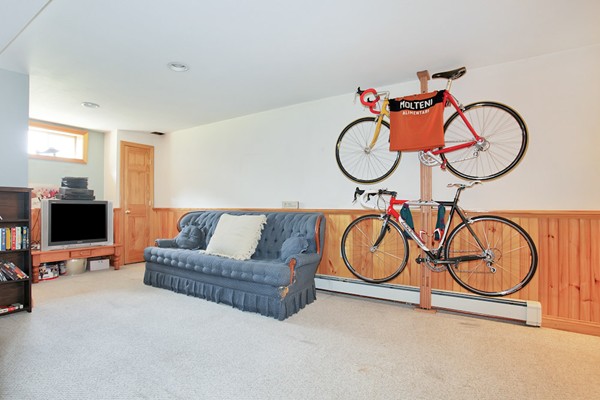 11 Robbins Road Ayer, MA 01432 - Photo 22 of 30 a living room with furniture a flat screen tv and a wall painting