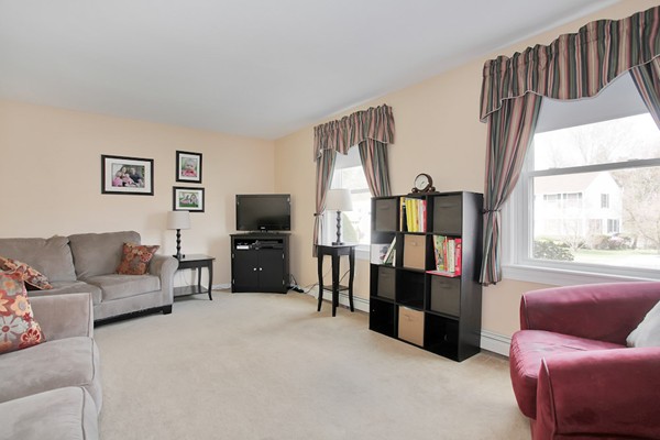 11 Robbins Road Ayer, MA 01432 - Photo 3 of 30 a living room with furniture and a flat screen tv