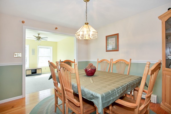 11 Robbins Road Ayer, MA 01432 - Photo 6 of 30 a dining room with furniture a chandelier and window