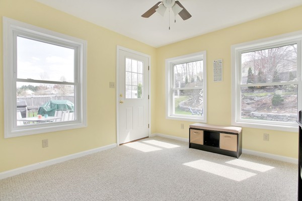 11 Robbins Road Ayer, MA 01432 - Photo 10 of 30 a view of an empty room with a fireplace and a window