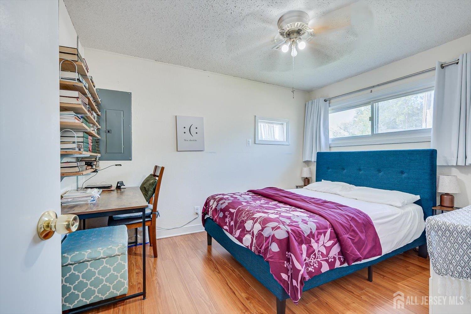 15 Markham Road Edison, NJ 08817 - Photo 22 of 32 a bedroom with a bed and a chandelier