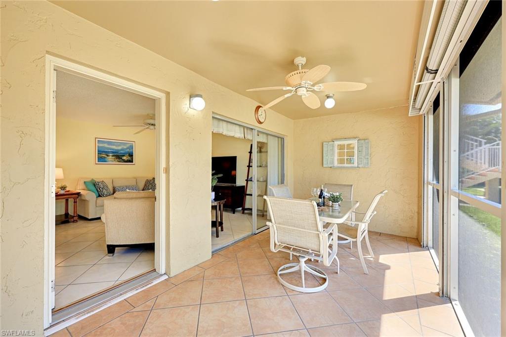 2000 Alamanda Drive, Unit 104 Naples, FL 34102 - Photo 16 of 32 a view of a livingroom with furniture and a window