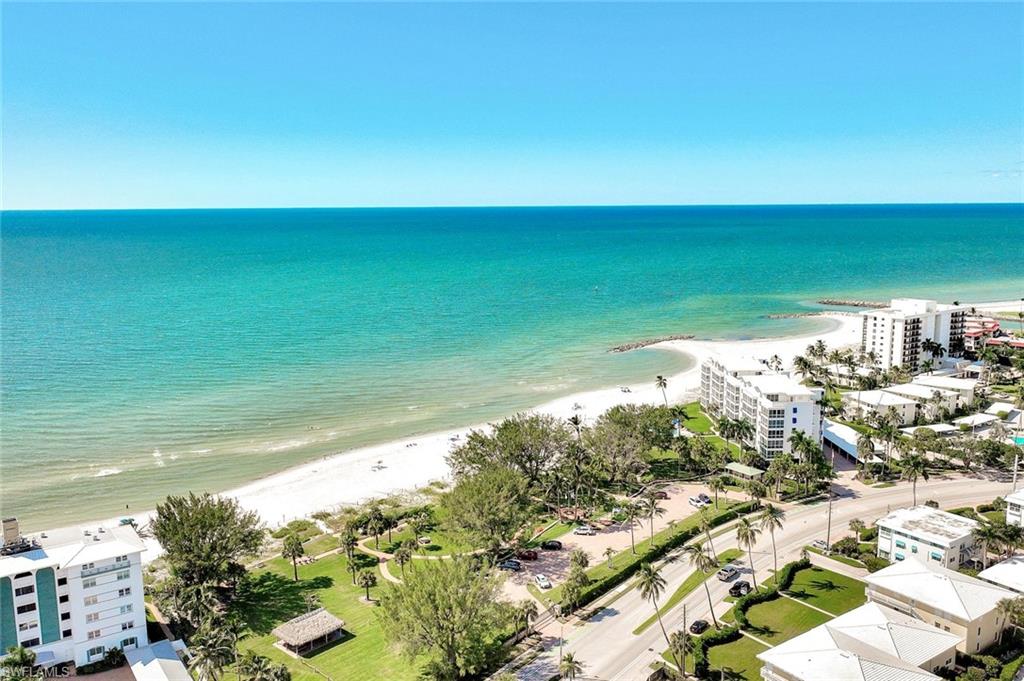2000 Alamanda Drive, Unit 104 Naples, FL 34102 - Photo 4 of 32 a view of a lake from a balcony