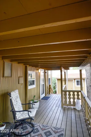 a view of living room and wooden floor